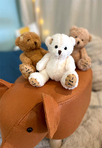 ours peluche pom violette